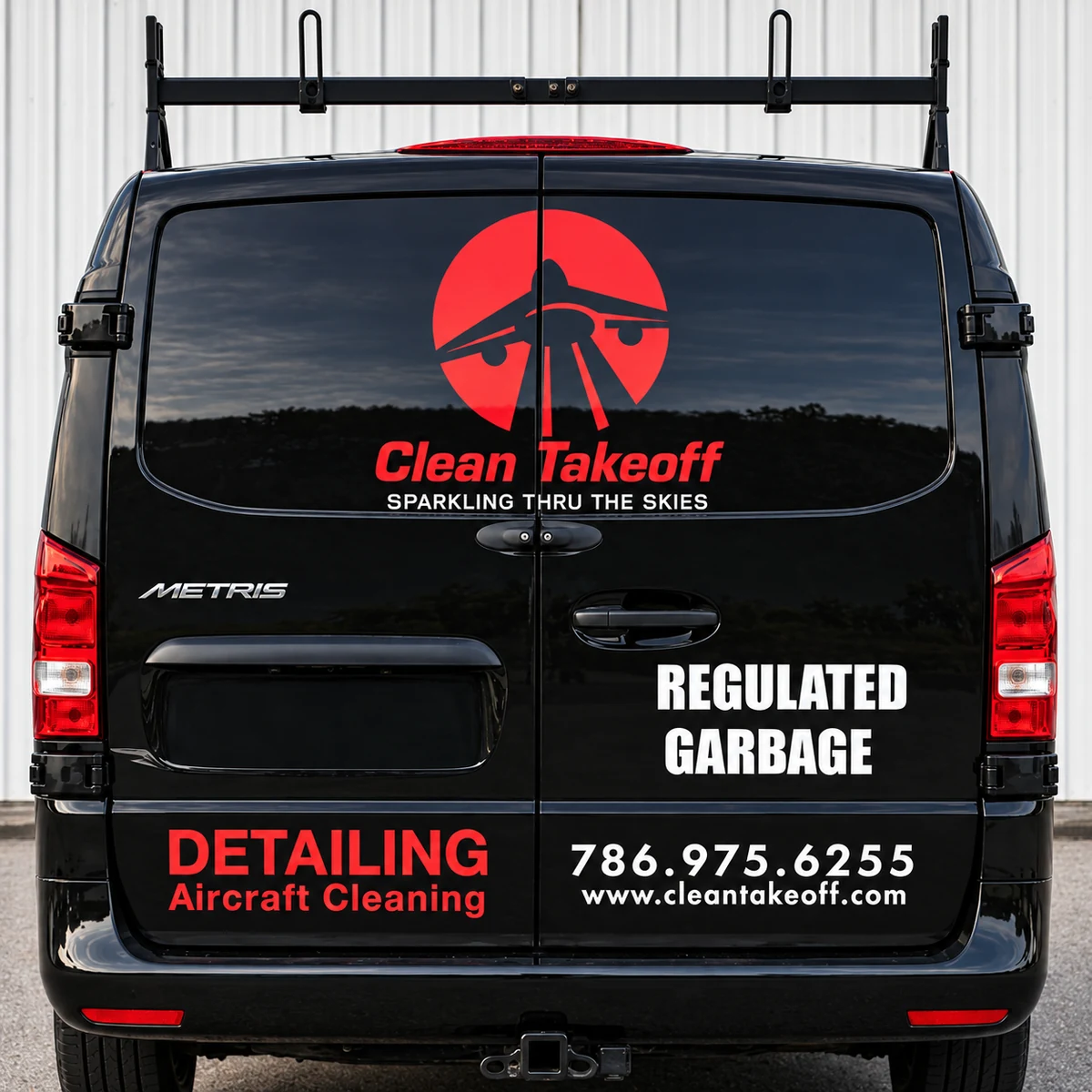 Rear of a Clean Takeoff service vehicle marked Regulated Garbage
